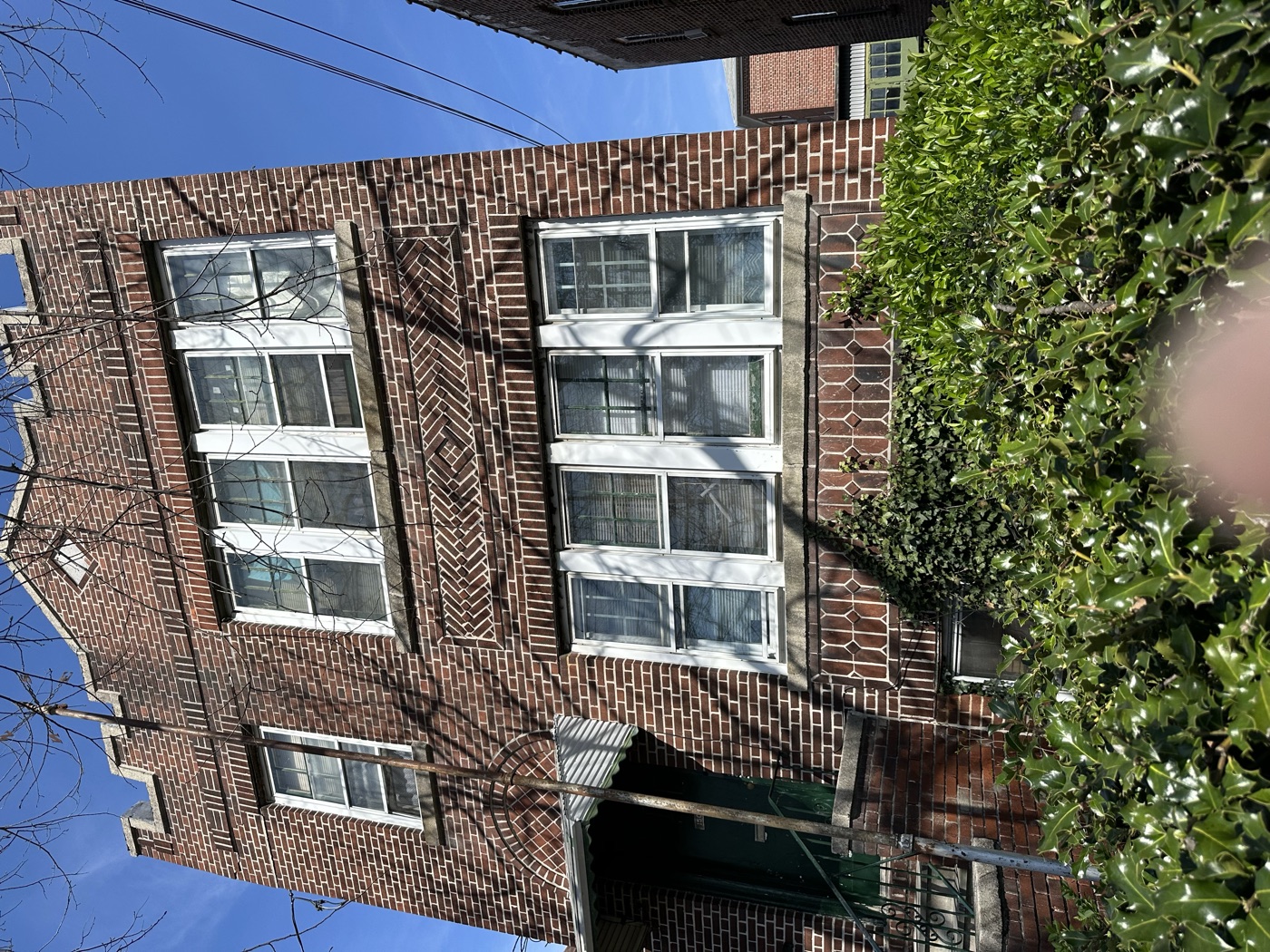 Pre-war brick two-family house with decorative brickwork, Bronx